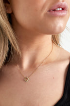 Halskette mit Kleeblatt und Diamanten