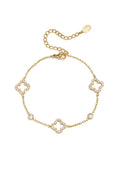 Armband mit durchbrochenem Muster und eingelegten Kleeblättern und Steinen