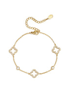 Armband mit durchbrochenem Muster und eingelegten Kleeblättern und Steinen